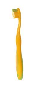yellow manual toothbrush on an isolated white background